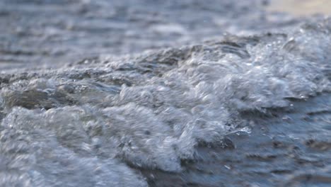 close-up-of-a-wave-created-by-a-small-boat-in-4k