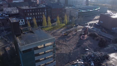 Demolished-multi-storey-car-park-concrete-construction-debris-in-town-regeneration-aerial-view-across-demolition-site-left