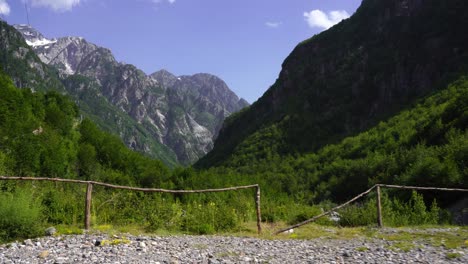 Alpine-landscape-with-high-mountains-and-valley-covered-in-lush-vegetation,-Theth,-Albania
