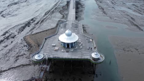 Bangor-Garth-pier-Victorian-ornamental-silver-dome-pavilion-landmark-tourist-aerial-view-seaside-attraction-rising-tilt-down