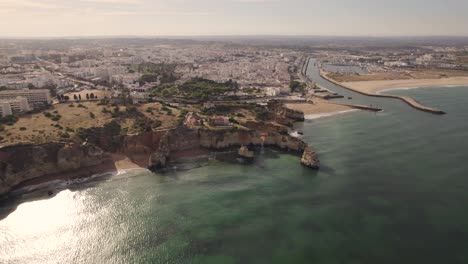 Luxury-real-estate,-detached-house-on-top-of-cliff-overlook-ocean,-Lagos,-Algarve