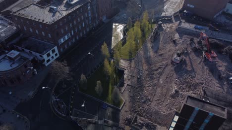 Demolished-multi-storey-car-park-concrete-construction-debris-in-town-regeneration-aerial-view-demolition