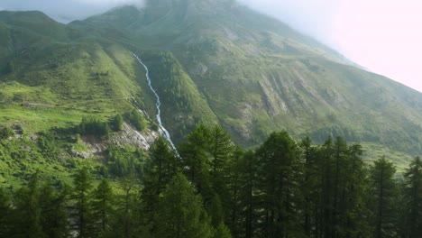 Aerial:-beautiful-mountain-valley-on-summer-day,-stream-cascading-down-mountain