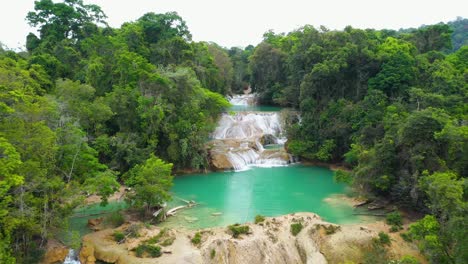 Aerial-reveal-of-Cascadas-Roberto-Barrios-waterfalls-in-Mexico,-tropical-scene