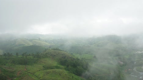 Flying-through-misty-clouds-above-green-tropical-hills-of-Hatton,-Sri-Lanka