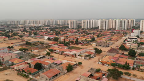 Travelling-front,-drone,-Centrality-of-Zango,-Luanda,-Angola,-Africa,-social-contrasts,-harsh-realities-today-1