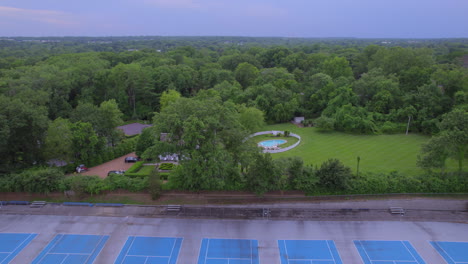 Tilt-down-to-reveal-tennis-courts-in-Ladue-in-St