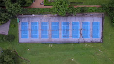 Overhead-view-of-tennis-courts-with-a-descent