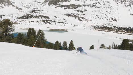 Skiing-girl-showing-fast-long-ski-turns-on-a-beautiful-ski-slope-in-a-ski-resort-in-austria-tirol