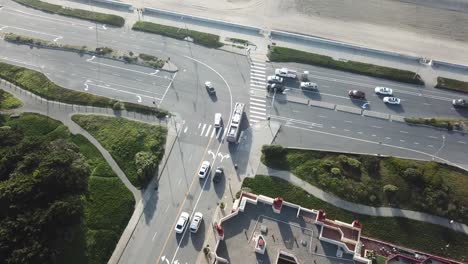 Traffic-flowing-down-busy-street-aerial