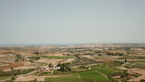 Scenic-Aerial-View-Of-Countryside-Plain-Landscape-In-Malta-Island