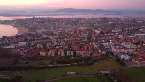 Santander-Spain-drone-fly-above-centro-botin-and-stadium-el-sardinero-during-colourful-sunset,-aerial-view-of-the-district-area-of-the-city