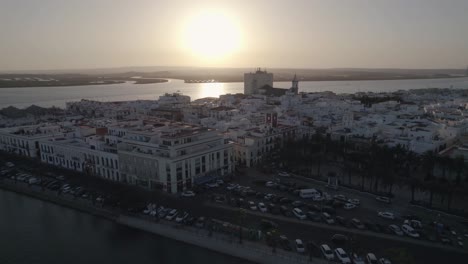 Aerial-view-of-historic-Ayamonte-town-against-Guadiana-River-at-sunset,-Huelva,-Spain