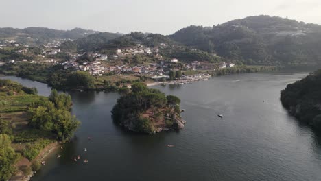 Aerial-circular-view-of-Love-island,-confluence-of-two-rivers:-Paiva-e-Douro