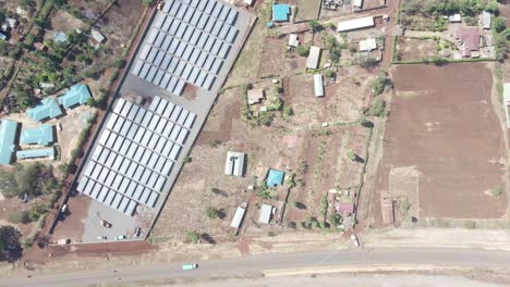 Aerial-top-down-view-of-a-rural-road-beside-the-market-of-loitokitok-Kenya
