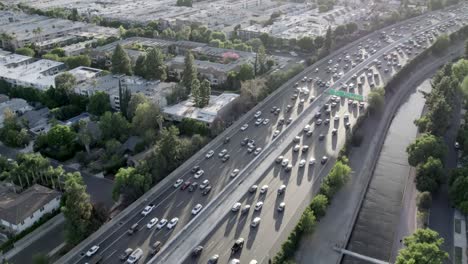 Aerial-view-crossing-above-Hollywood-101-freeway-urban-highway-traffic-city-rush