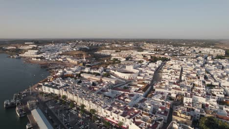 White-cityscape-of-Ayamonte-town-in-Spain,-aerial-fly-over-view