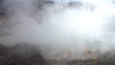 Hot-Spring-Mineral-Water-and-Steam-Above-Natural-Pool-in-Yellowstone-National-Park,-Wyoming-USA,-Panorama