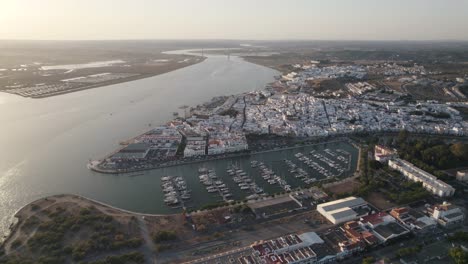 Aerial-forward-view-of-coastal-town-of-Ayamonte-with-its-marina