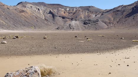 Pan-across-rugged-volcanic-ash-landscape-in-Tongariro-National-Park