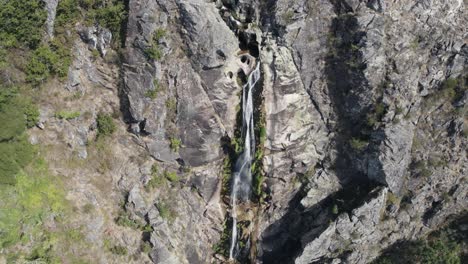 Aerial-descending-view-of-waterfall-named-"Frecha-da-Mizarela