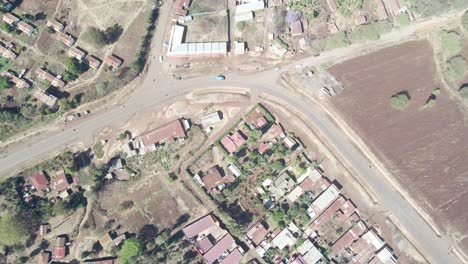 Aerial-view-of-"L"-curve-junction-of-a-rural-road-in-Loitokitok,-Kenya