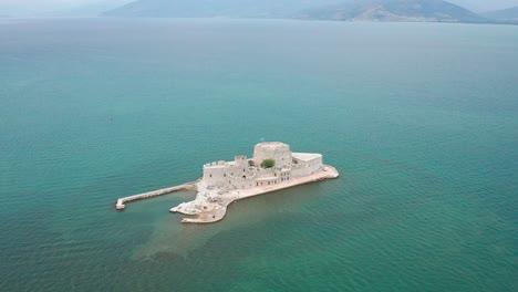 Drone-shot-of-fairy-tale-castle-in-the-middle-of-the-sea,-Greece
