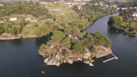 Island-of-Love-in-Castelo-De-Paiva,-Portugal,-aerial-drone-orbit-view