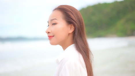 Close-up-of-a-young-woman-profile-with-the-ocean-shoreline-in-the-background