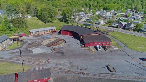 An-Aerial-View-of-an-Abandoned-Narrow-Gauge-Coal-Rail-Road-Round-House-and-Turntable-and-Support-Building-Starting-to-be-Restored