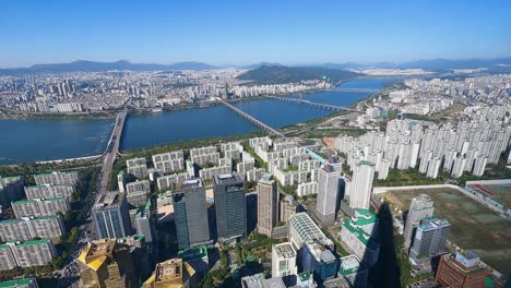 Cloudless-Sunny-Day-Seoul-Skyline-Riverside-Cityscape-view-from-tallest-building-aerial-panorama-4k-timelapse-South-Korea,-time-lapse