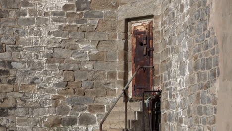 Rusted-dungeon-like-prison-door-in-wall-of-Eastern-State-Penitentiary