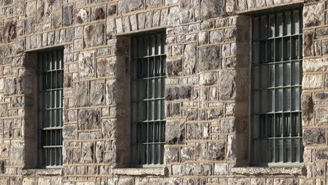 Barred-windows-in-masonry-wall-building