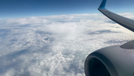 View-through-an-airplane-window-on-the-sky-and-clouds