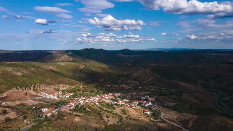 Aerial-Hyperlapse-over-a-small-village-surrounded-by-mountains