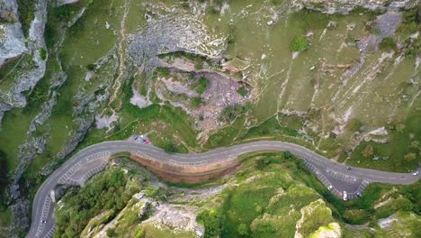 Top-view-of-curvy-road-amidst-mountain