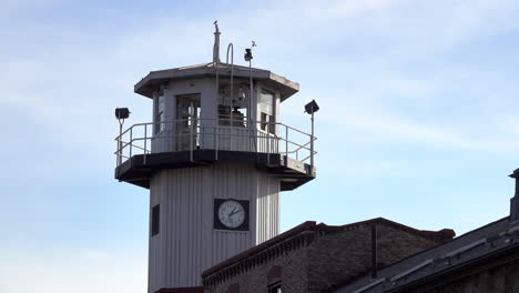 Prison-guard-tower-looms-above-cellblock