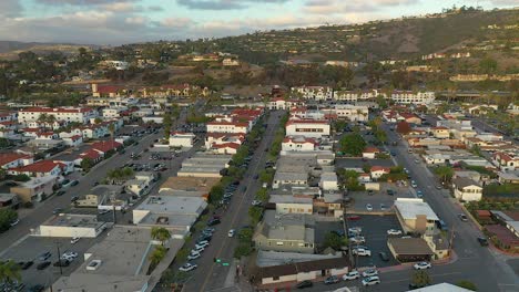 Aerial-spin-over-downtown-San-Clemente,-California-during-golden-hour