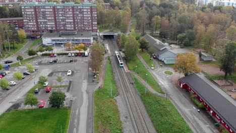 Aerial-circling-at-Gärdsås-Torg-tram-station,-Gothenburg,-Sweden