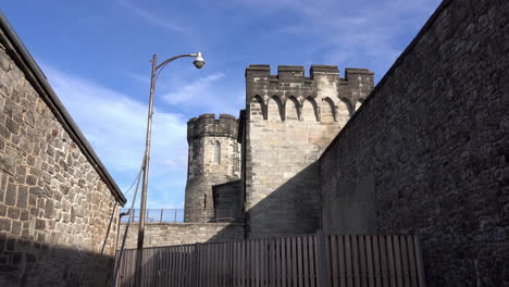 Long-shot-of-medieval-style-wall,-towers-and-parapet-at-Eastern-State-Penitentiary
