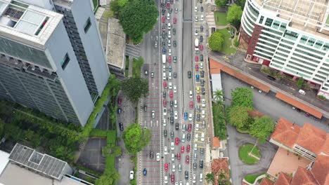Top-down-birds-eye-view-capturing-the-congested-traffics-on-jalan-tun-razak-in-downtown-kuala-lumpur-at-peak-hour,-malaysia-southeast-asia