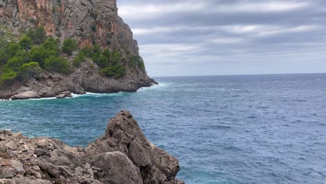 Shoreline-With-Waves-Hitting-The-Cliffs,-Sa-Calobra-Mallorca,-Spain