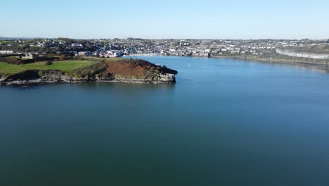An-aerial-panorama-slide-over-water-near-James-Fort-and-Kinsale-harbour-in-the-distance-on-a-sunny-day