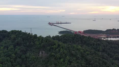 Drone-fly-around-vale,-the-multinational-global-mining-company-site-in-manjung,-perak,-malaysia-overlooking-at-straits-of-malacca-and-teluk-rubiah-maritime-terminal