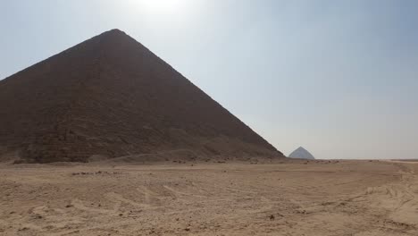 Mesmerizing-view-of-red-or-north-Pyramid-at-Dahshur-necropolis-in-Cairo,-Egypt-amidst-dry-arid-land