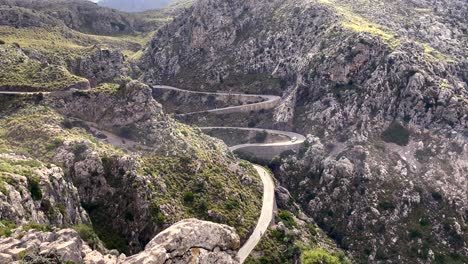 Traffic-At-Curved-Road-In-Mountains,-Sa-Calobra-Roads-Mallorca,-Spain,-Aerial-Static-View