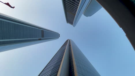 Warms-eye-view-of-skyscrapers-with-the-camera-rotating-around-them-underneath-om-slow-motion