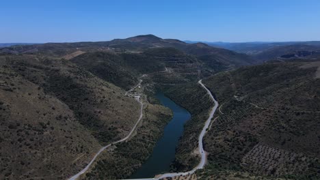 Aerial-view-of-the-Tua-river-in-the-north-of-Portugal-surrounded-by-mountains-and-valleys