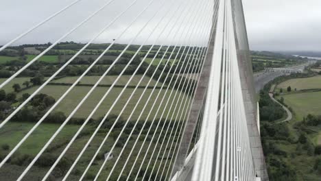 Dramatic-aerial-view-of-cable-stayed-bridge-towers,-cables-and-decking