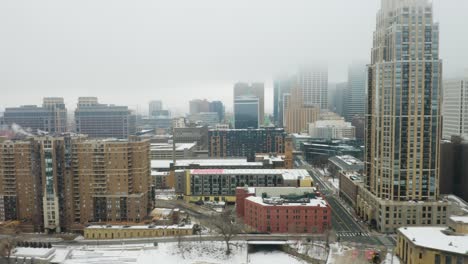 Tracking-Shot-of-Foggy-Minneapolis-Skyline-on-Frigid-Winter-Day